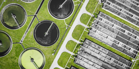 Sewage farm. Static aerial photo looking down onto the clarifying tanks and green grass. Geometric...