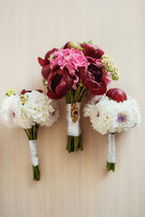 Red and white bouquets lie on bright table