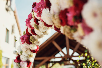 Wedding altar decorated with red and white chrysanthemums