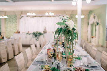 Little bouquet of greenery and white flowers