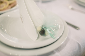 Little pocket with sweets stands on dinner plate