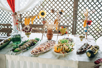 Table with salty snacks served in ethnic style