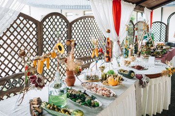 Table with salty snacks served in ethnic style