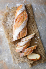 Sliced Baguette on the sackcloth