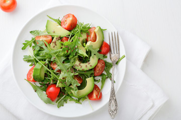 Green Avocado Salad with tomatoes and arugula