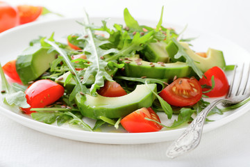 Fresh Salad with avocado, cherry tomatoes and arugula