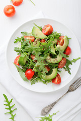 Light Avocado Salad with tomatoes and arugula