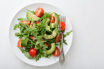 Light Salad with avocado, cherry tomatoes and arugula