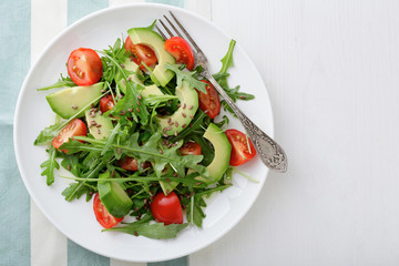 Fresh Avocado Salad with cherry tomatoes and arugula