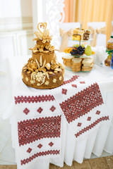 Wedding bread stands on the embroidered towel