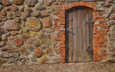 Wooden, old door in the wall 1