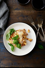 Pasta with bolognese sauce on a plate and wine
