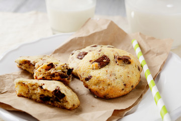 Milk with crispy cookies on paper