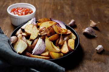 Baked potatoes with sauce and garlic