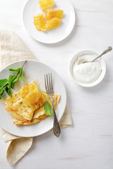 Crepe with honey comb and sour cream
