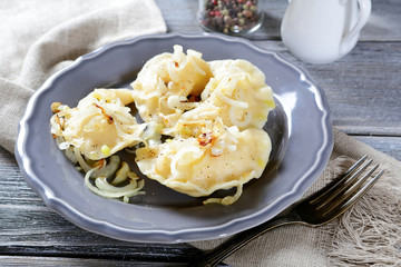Pierogi with potatoes on a plate