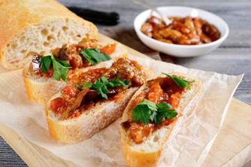 Toast with vegetables on a cutting board