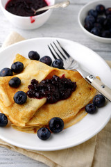 Delicious crepes with jam and berries