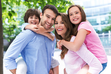 Family smiling together outdoors

