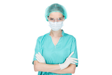 surgeon in medical mask standing with arms crossed isolated on white
