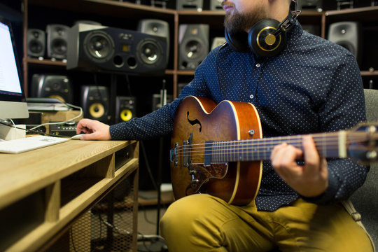 Man recording music in studio