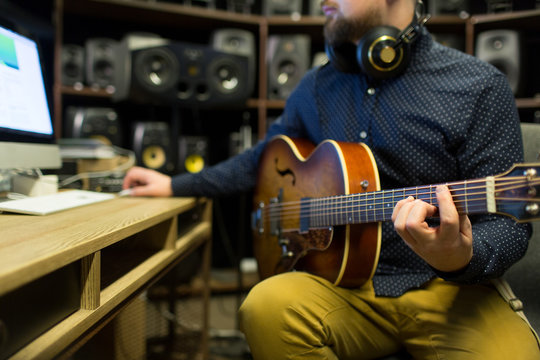 Man recording music in studio
