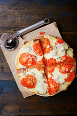 Sliced Italian Pizza with tomatoes and mushrooms