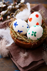 Colored Easter eggs in a nest