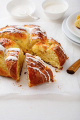 Piece sweet bun with cream on white table