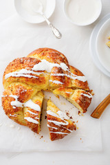 Fresh sweet bun with cream on white paper