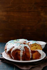 Icing Easter cake on white plate