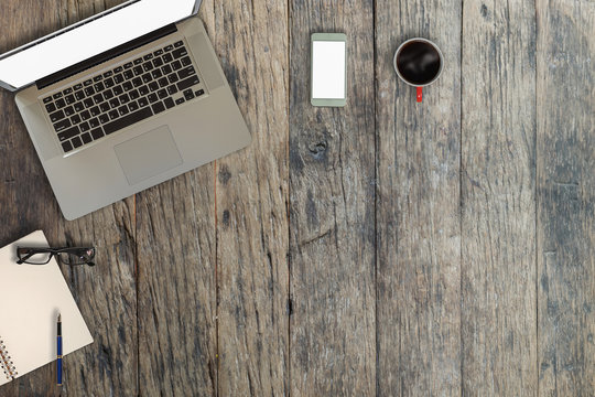 Laptop On Vintage Wooden Desktop In Modern Office With Accessories - Top View On Desk From Above.