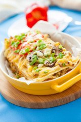 Delicious Italian Lasagna in yellow dish