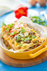 Delicious Italian Lasagna in yellow dish