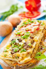 Traditional Italian Lasagna on a wooden kitchen board