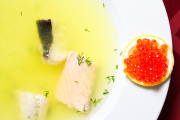 Fish soup with lemon and red caviar