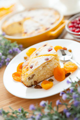 Cheese dessert with dried apricot and raisins close-up on a plate
