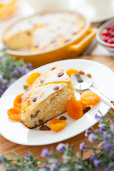 Cheese Pie with dried apricot and raisins close-up on a plate