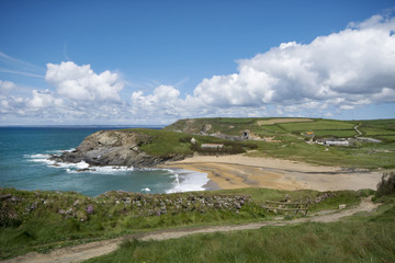 incoming tide and sandy beach at church cove gunwalloe Cornwall 