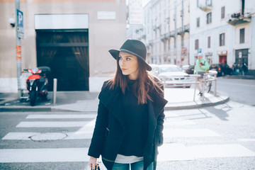 young woman outdoor walking looking away pensive - attitude, confidence, serious concept