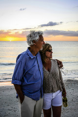 Active retirees enjoy the sunset on Siesta Key beach FL