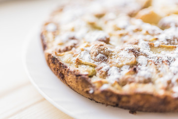 Apple pie sprinkled with powdered sugar
