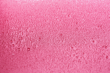Water drops on pink background