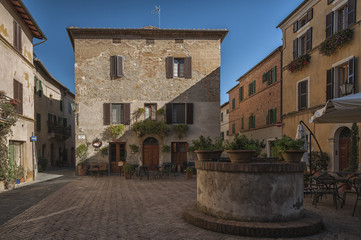  Beautiful narrow street in the small magical and old village of Pienza, Val D'Orcia Tuscany - Italy