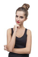 Pensive woman in a black tank top isolated