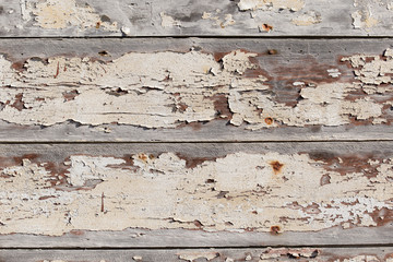 Aged paint cracked wooden wall