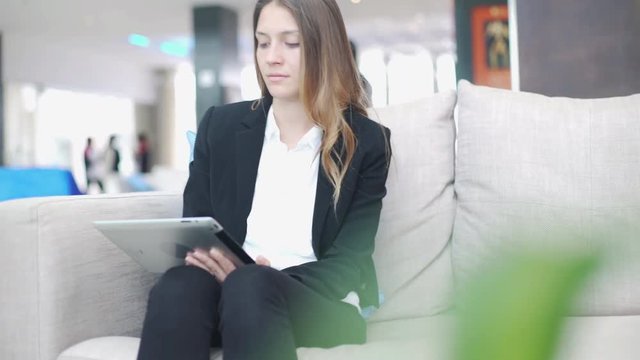 Woman using digital tablet