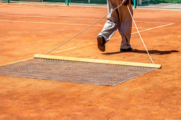 Preparation of a ground tennis court
