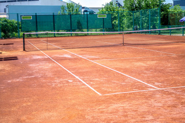Watering of the ground tennis court with water
