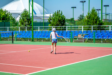 A little tennis player on the court